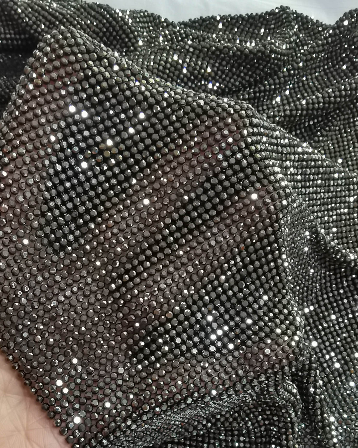 Close-up of hematite crystal mesh fabric with 2mm crystals in gray casing