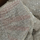 close up of a crystal mesh silver fabric made with glass rhinestones